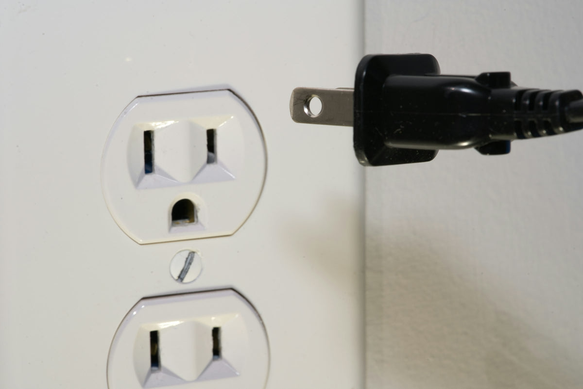 Wall outlet with a plug